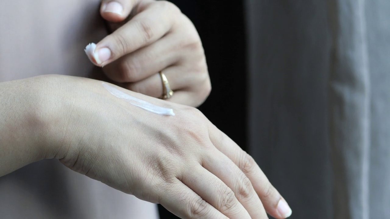 Hands with a soft manicure in warm light
